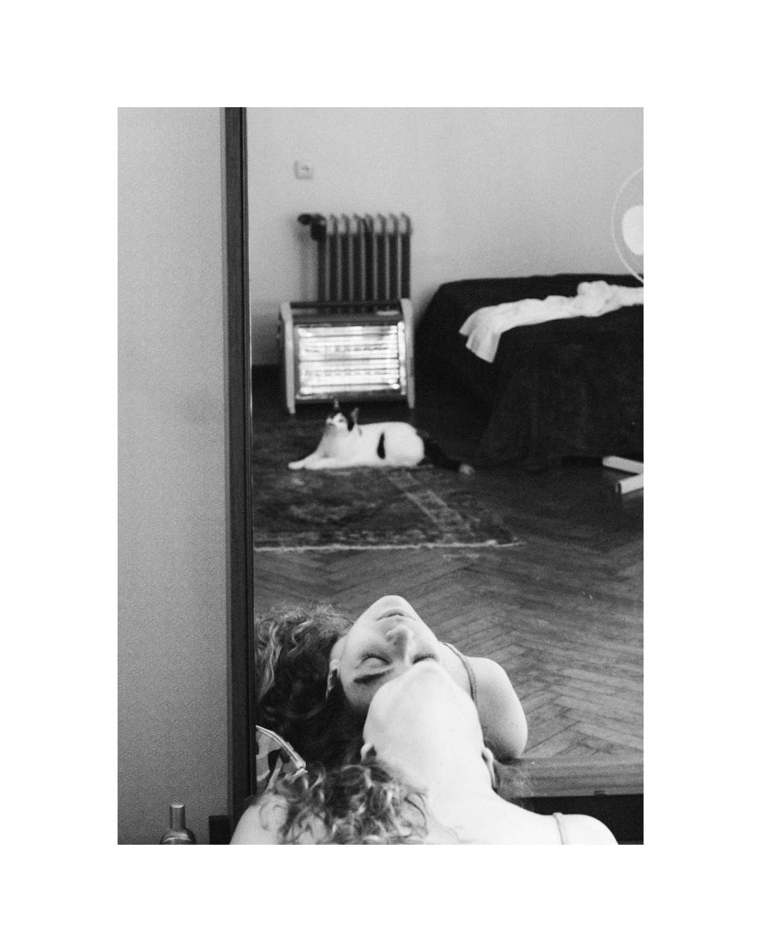 Monochrome view of a woman in a furnished room by Lilit L Hovhanni.