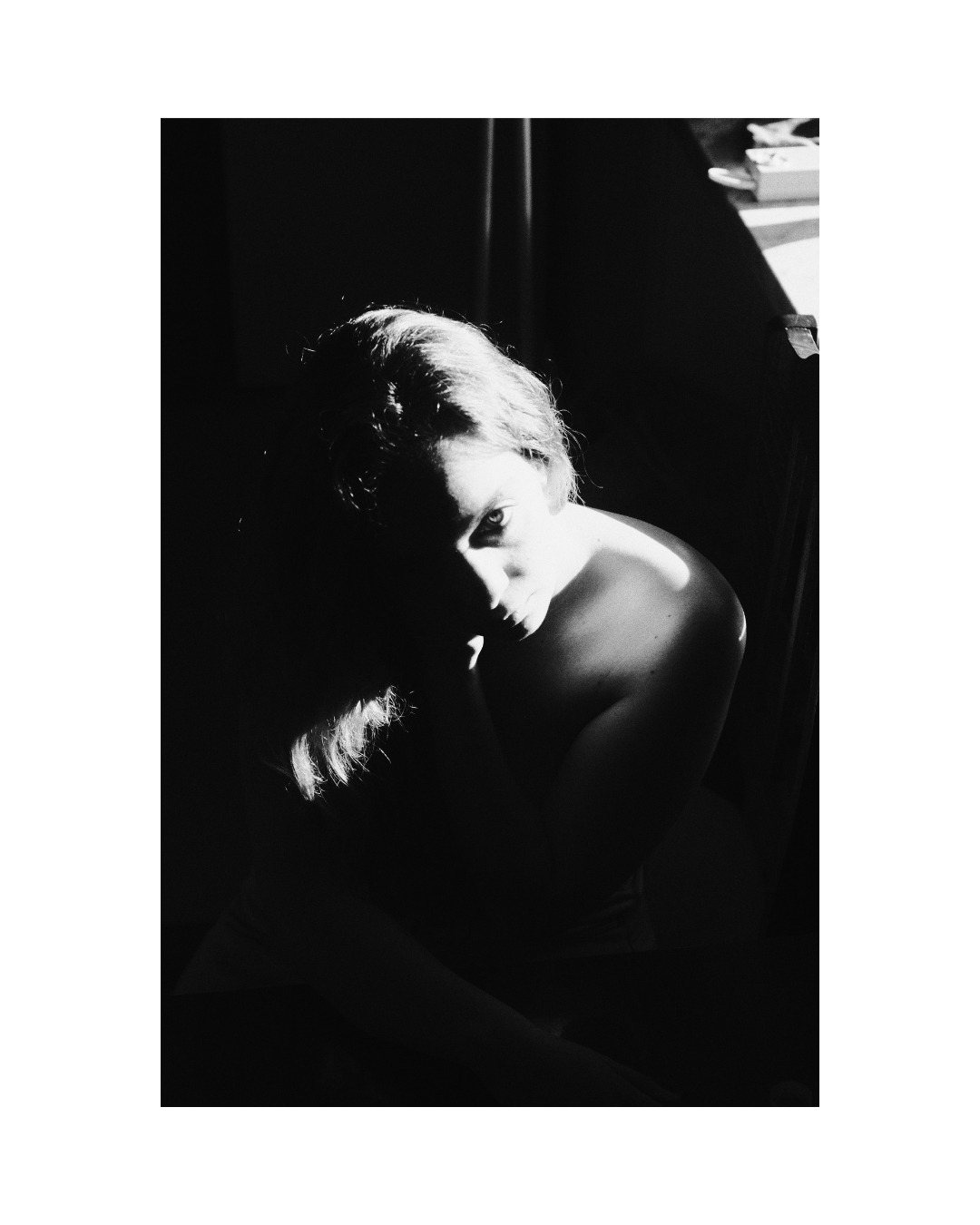Monochrome view of a woman in a furnished room by Lilit L Hovhanni.