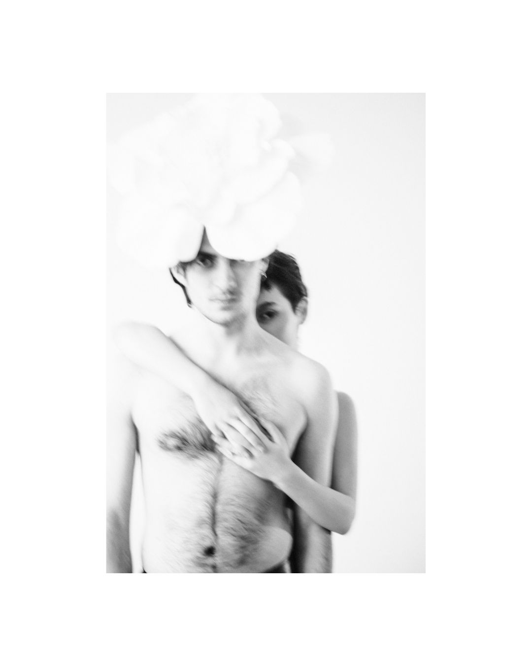 Two figures close together in a room, in black and white, by Lilit L Hovhanni.