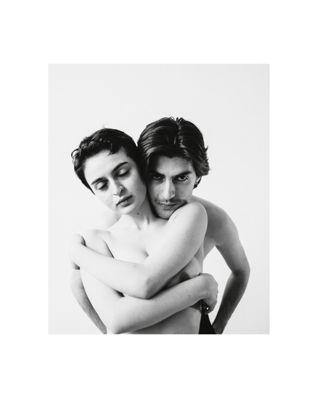 Black-and-white study of closely arranged figures and cropped bodies by Lilit L Hovhanni.