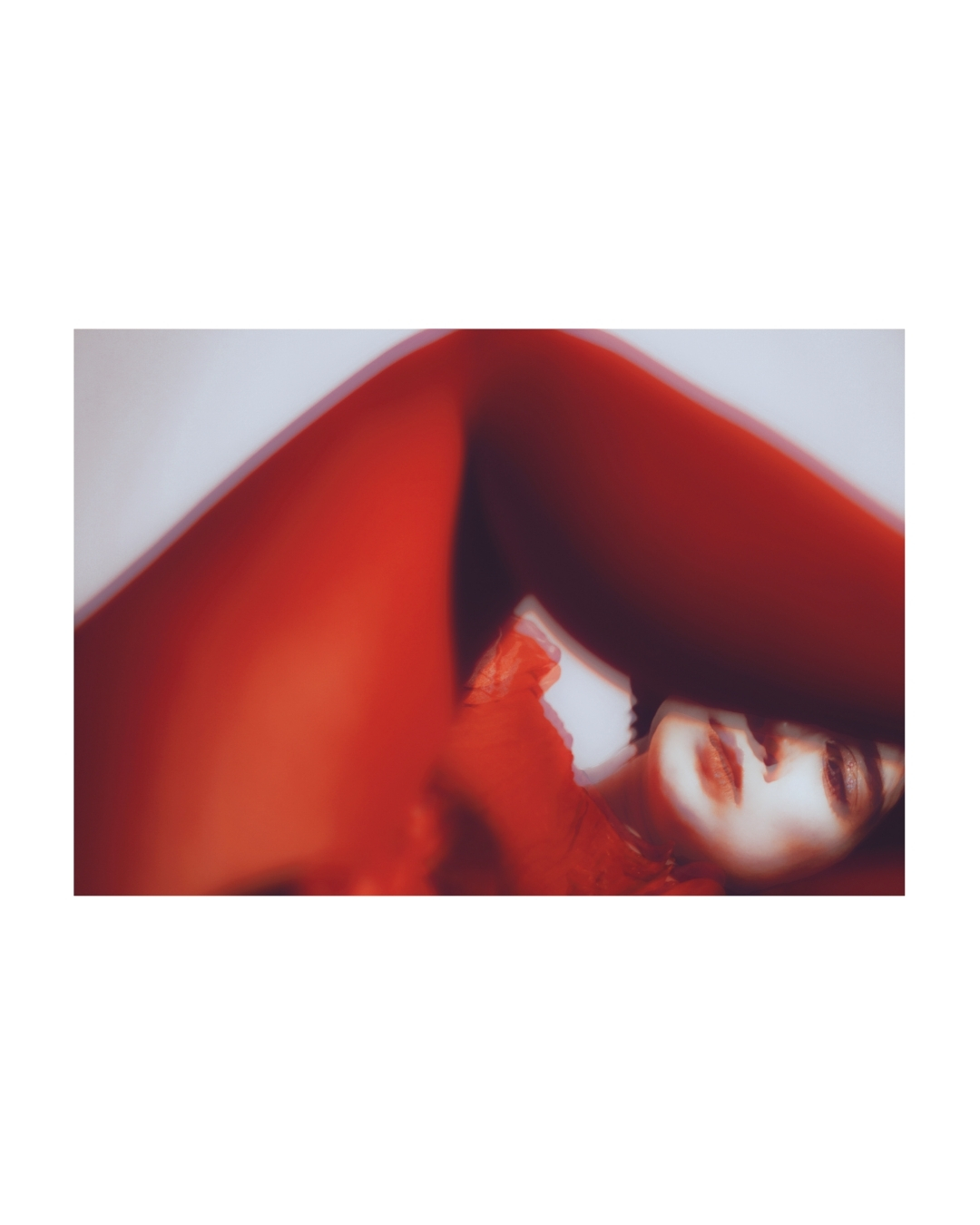 A figure partly hidden by blurred colour in an interior, by Lilit L Hovhanni.