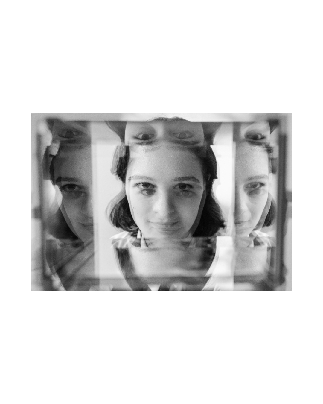 A figure with a rectangular frame before the face, in black and white, by Lilit L Hovhanni.