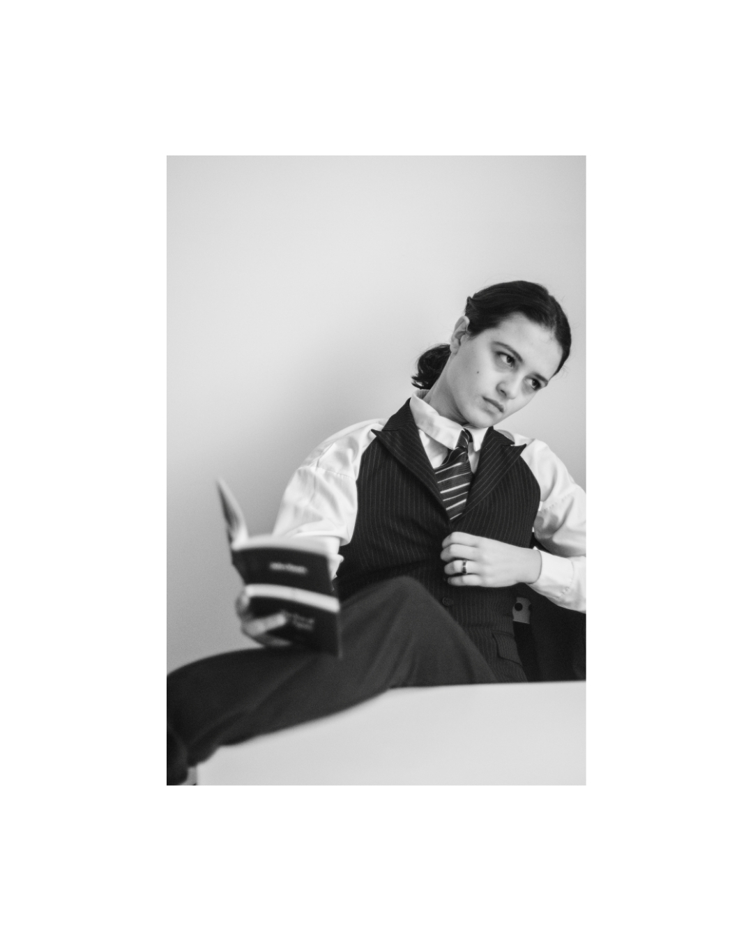 A woman with short dark hair in a vertical monochrome composition by Lilit L Hovhanni.