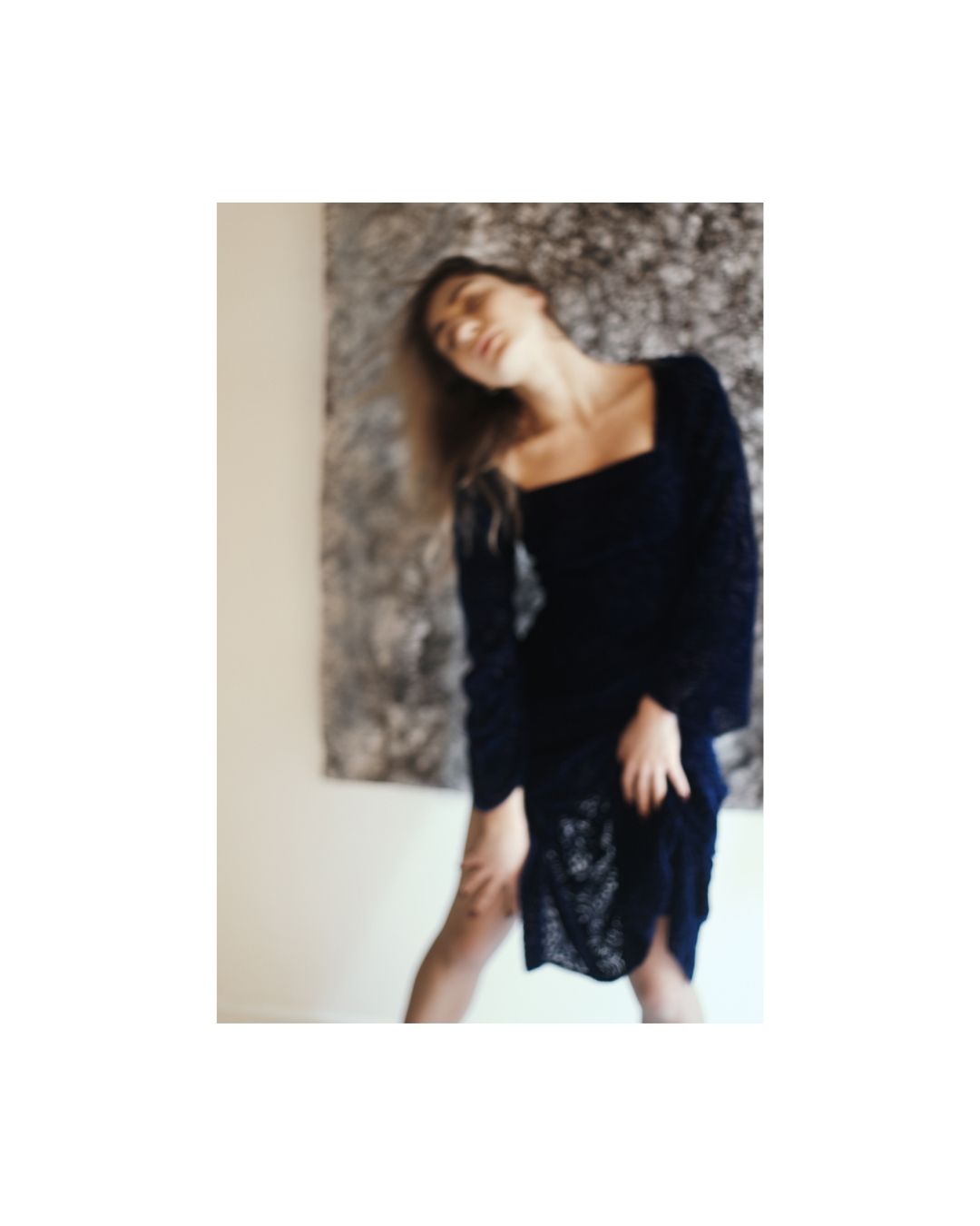 Soft-edged portrait of a woman against a textured backdrop by Lilit L Hovhanni.