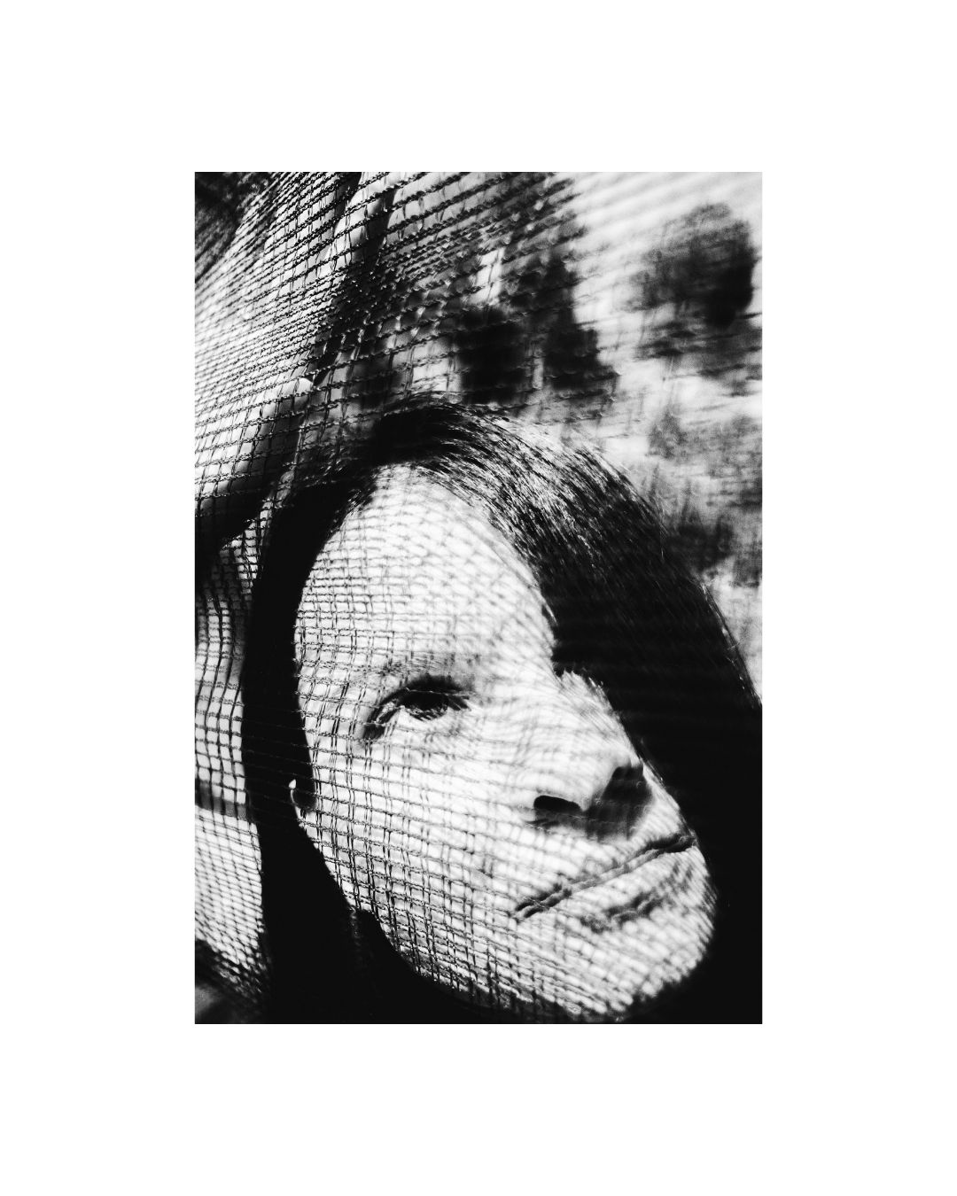 Cropped view of a person in a vertical frame with a white border, by Lilit L Hovhanni.