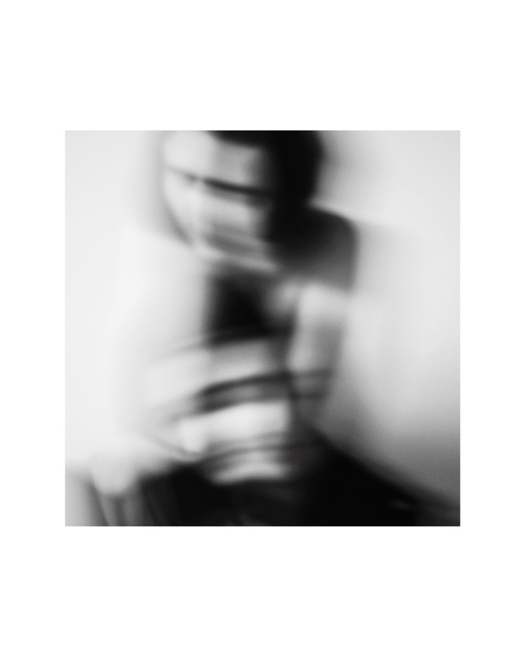 Cropped view of a person in a vertical frame with a white border, by Lilit L Hovhanni.