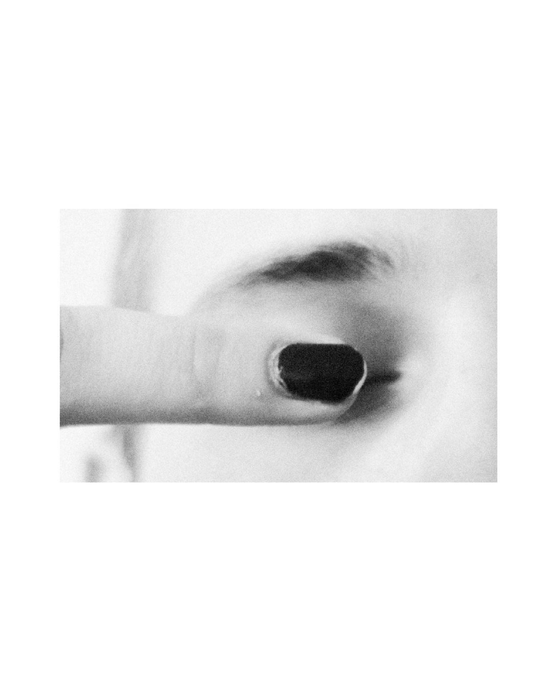 A monochrome study of facial features and a hand gesture by Lilit L Hovhanni.