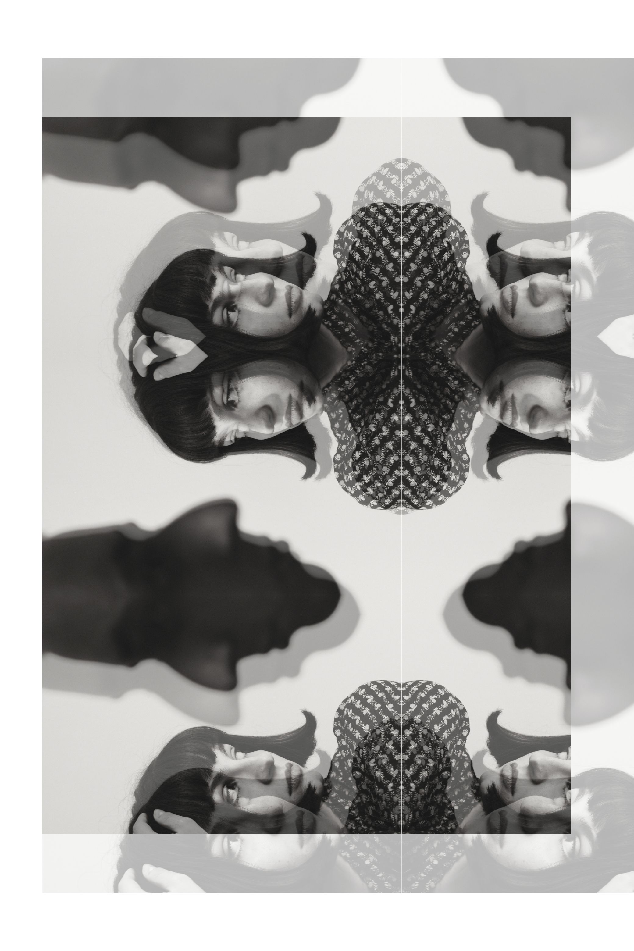 Strips of the same photograph stacked into one tall image, in black and white.