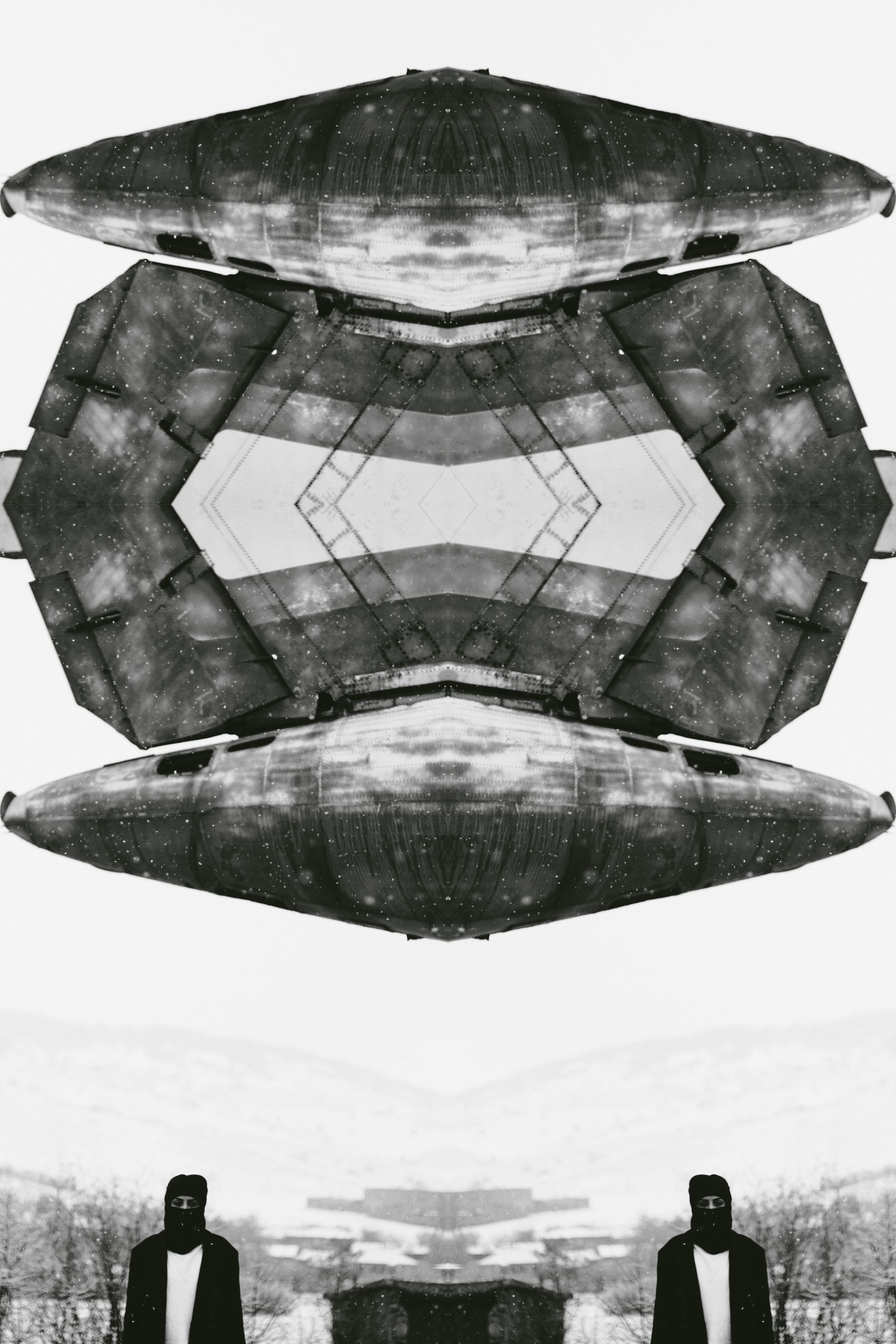 One face or gesture copied over and over into a single frame, in black and white.