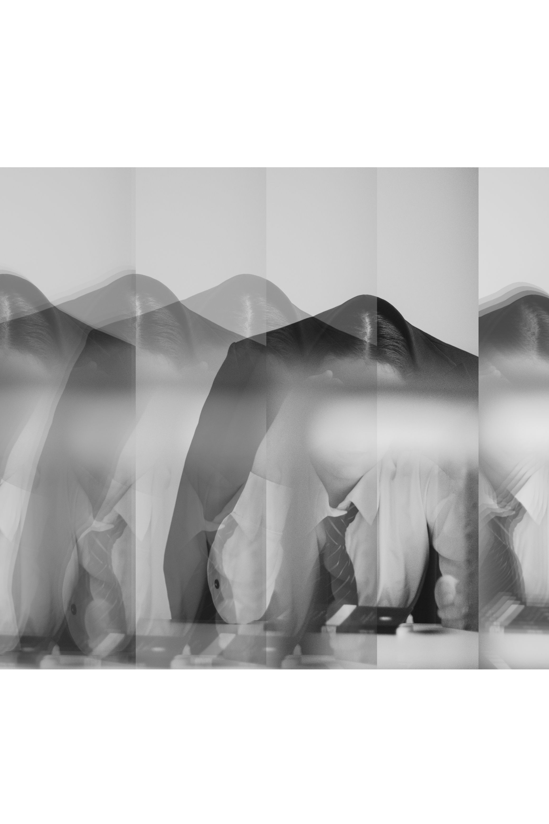 Strips of the same photograph stacked into one tall image, in black and white.