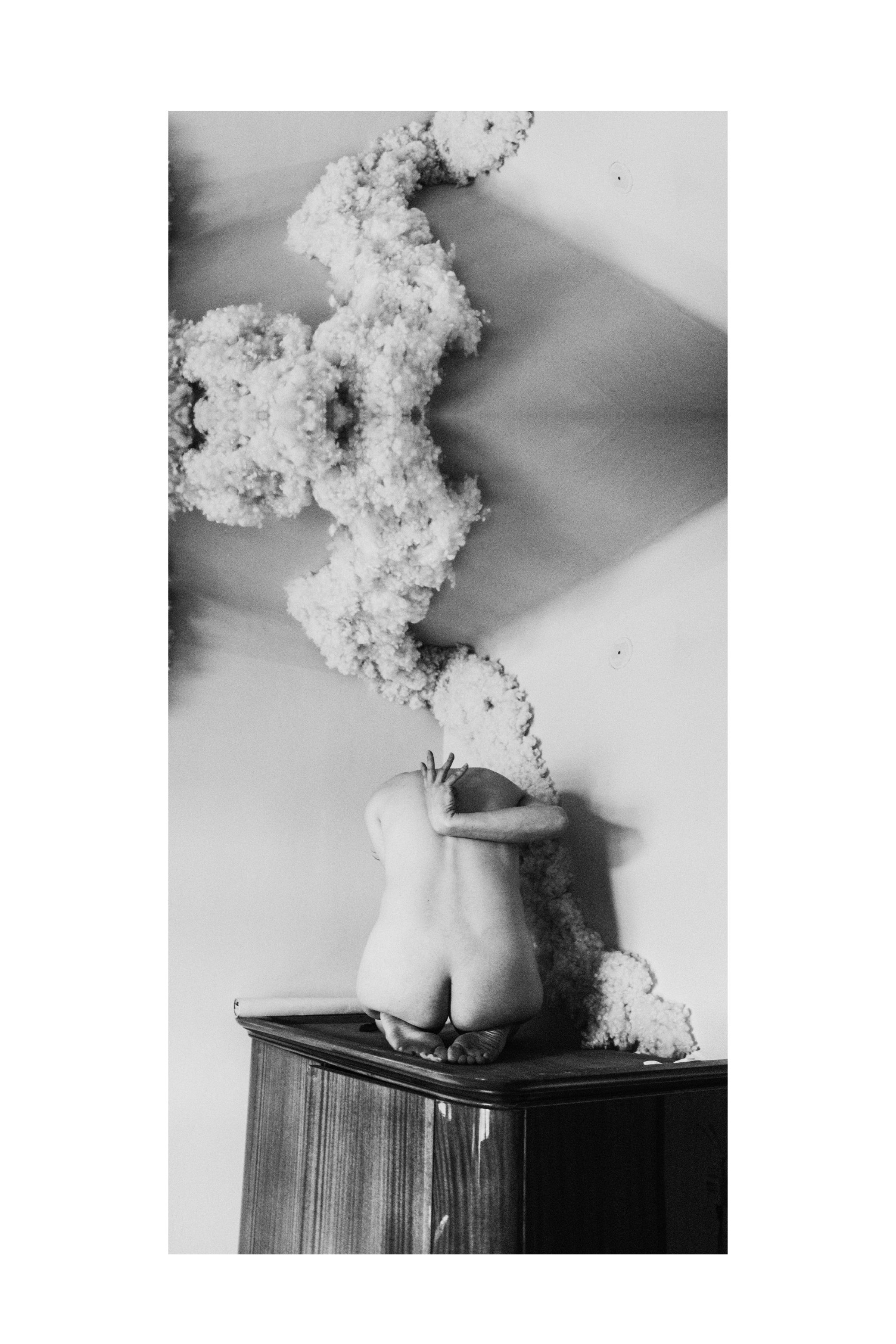 Strips of the same photograph stacked into one tall image, in black and white.