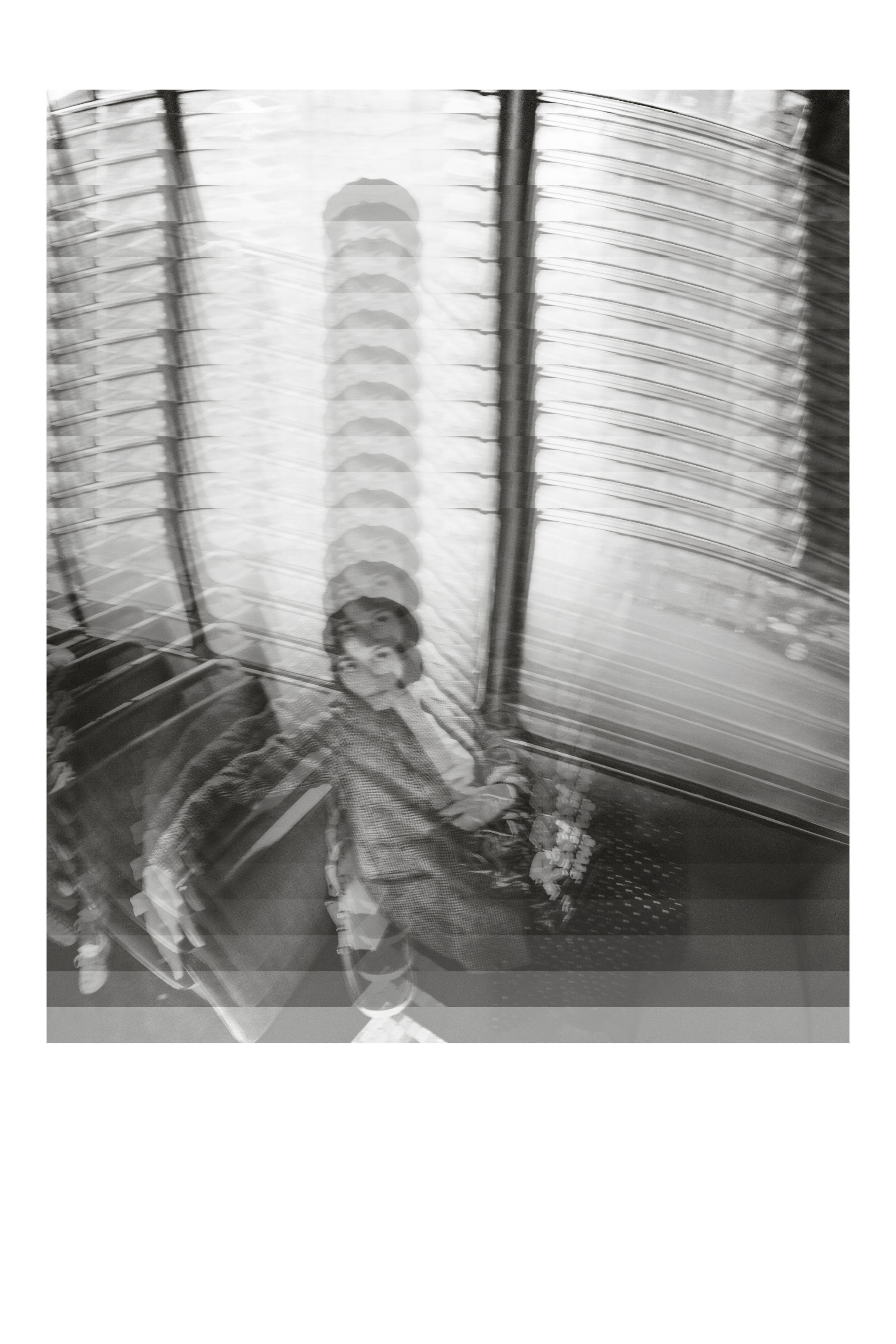 One face or gesture copied over and over into a single frame, in black and white.