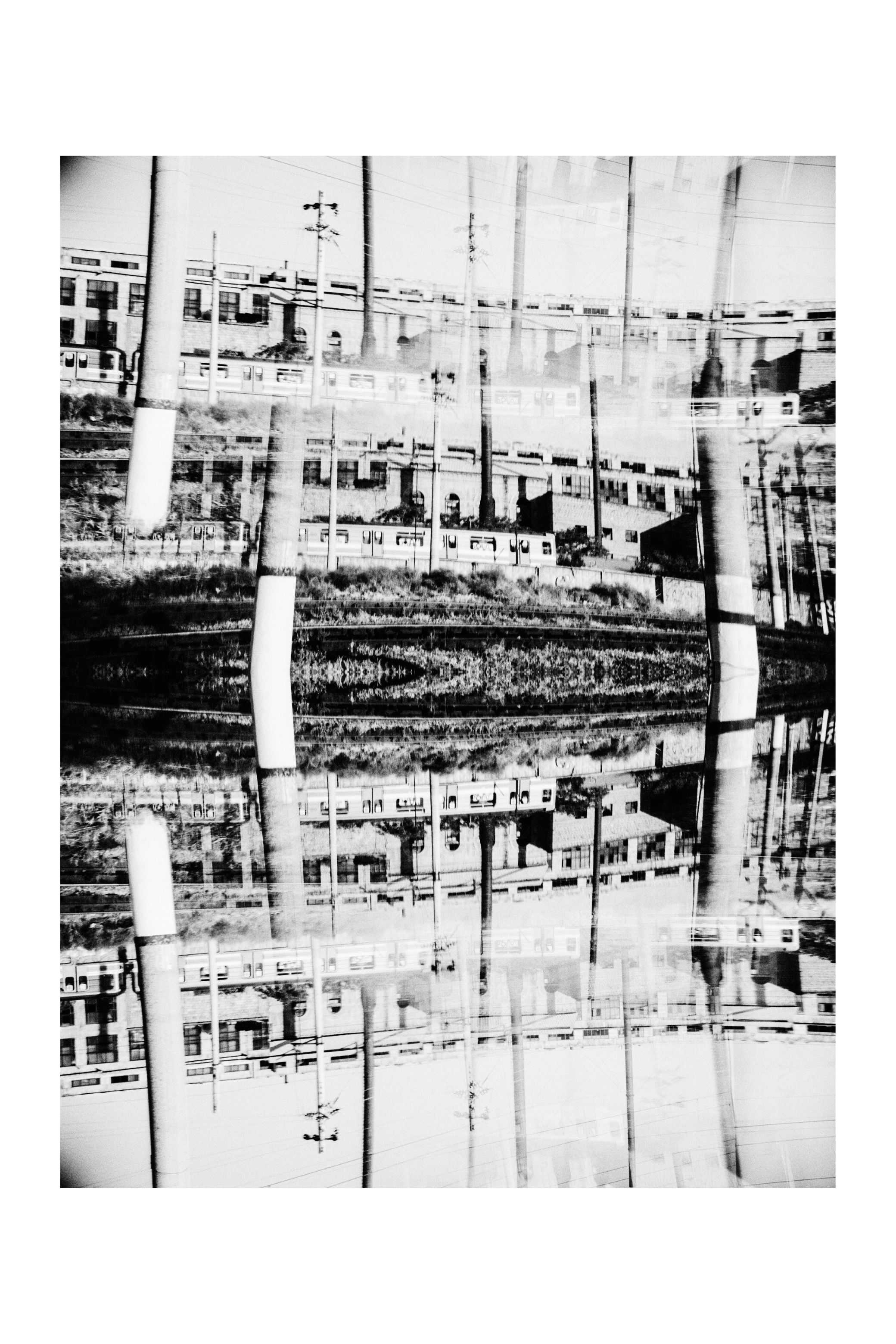 Strips of the same photograph stacked into one tall image, in black and white.