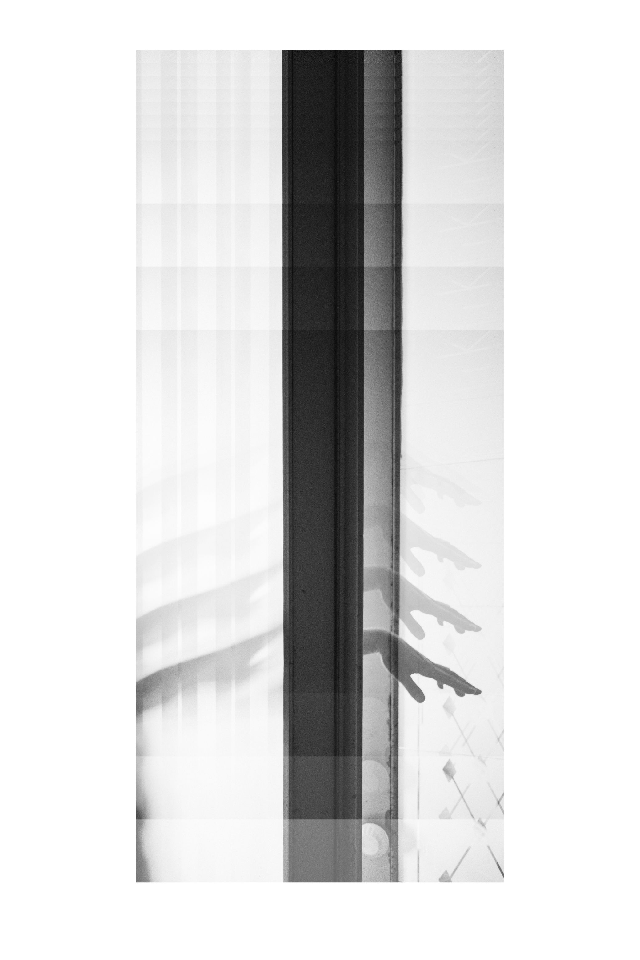 Strips of the same photograph stacked into one tall image, in black and white.